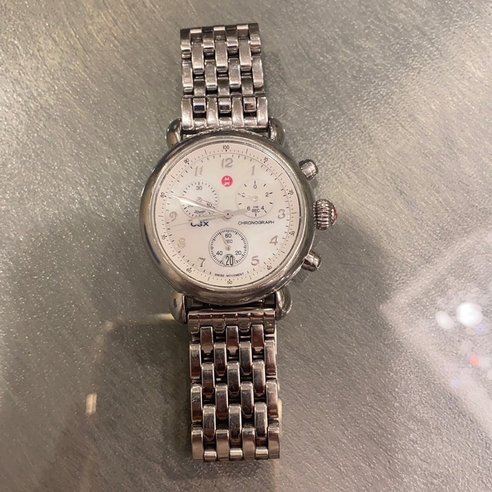 Real women’s Michele watch. Silver link band. Used but good condition.